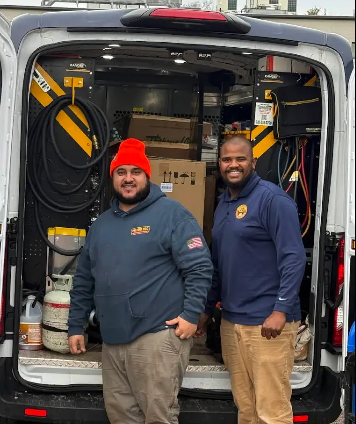 Yellow Dog technicians in front of service van