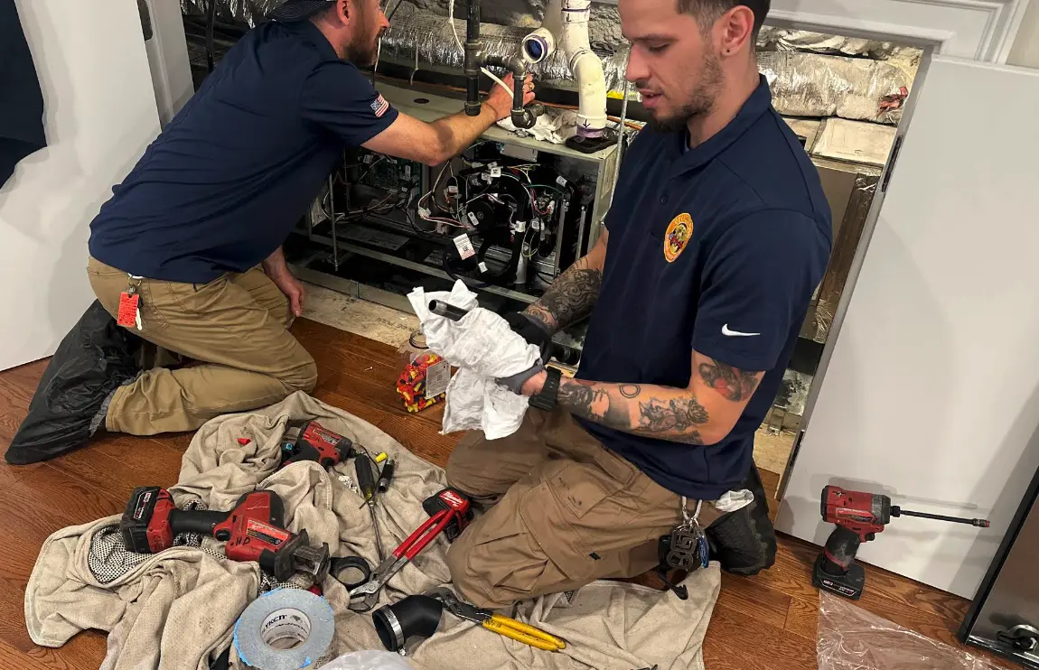 Yellow Dog plumber working on a water heater