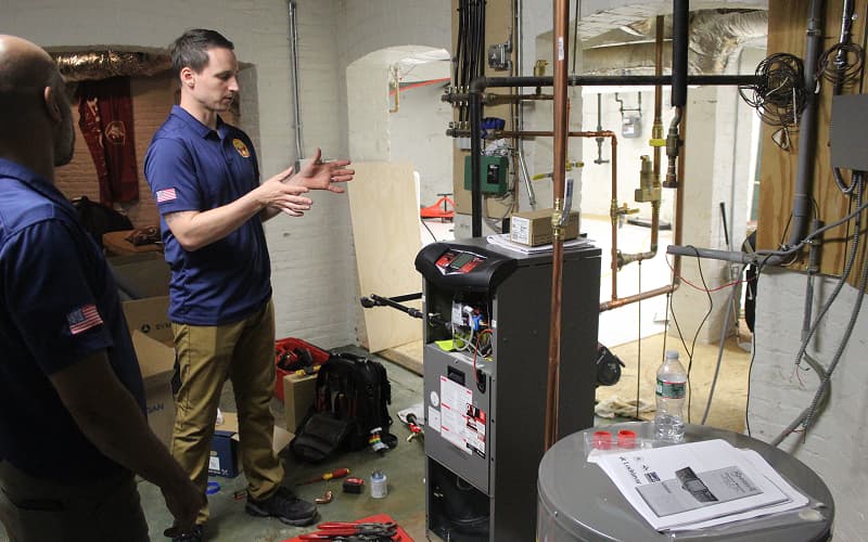 Yellow Dog technicians inspecting a boiler